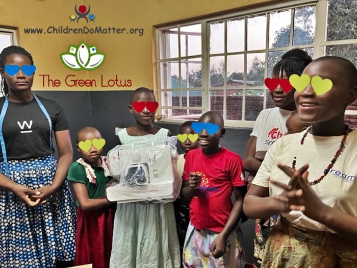 girls receive sewing machines - the green lotus malawi - children do matter